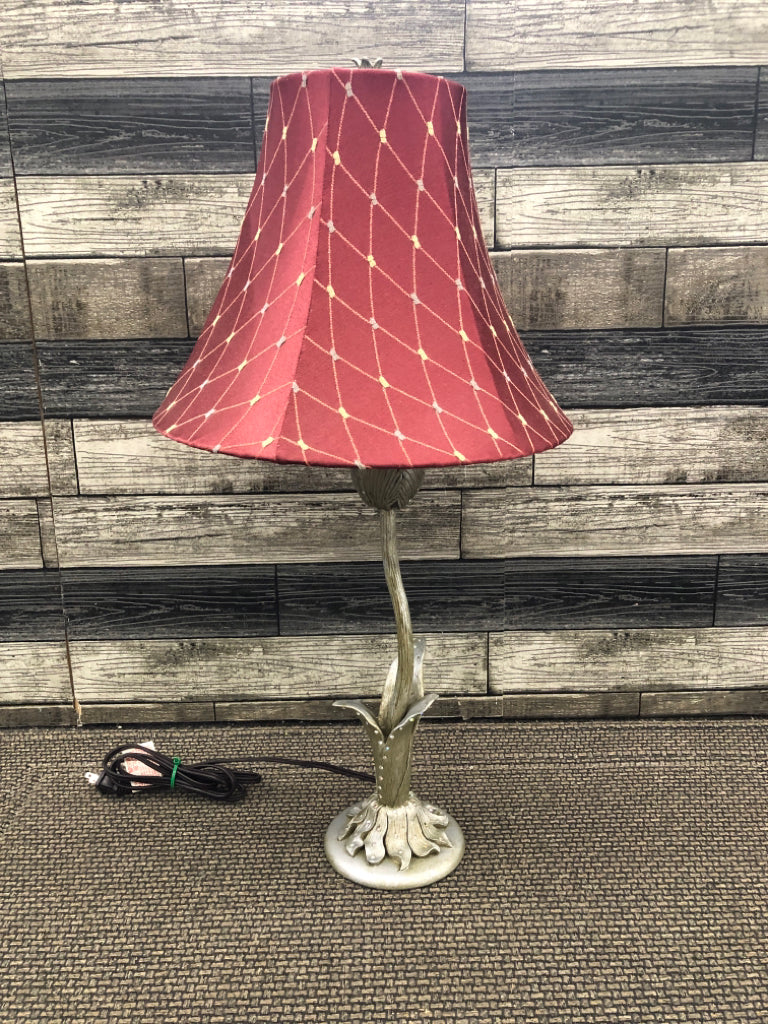 SILVER FLOWER BASE LAMP W/RED SHADE.