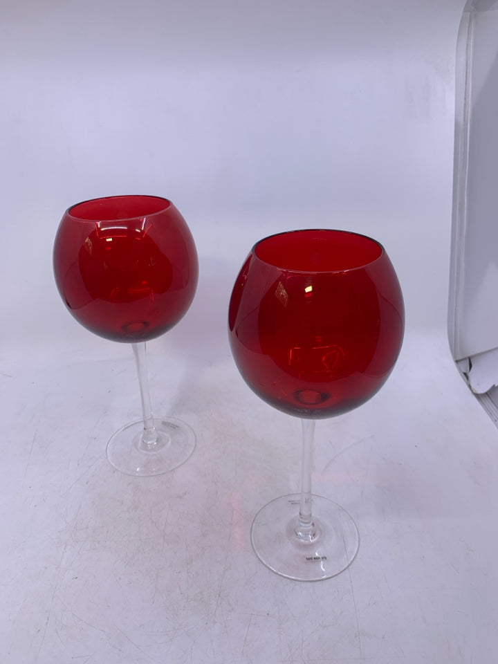 2 CLEAR GLASS STEM W/ RED TOP WINE GLASSES.