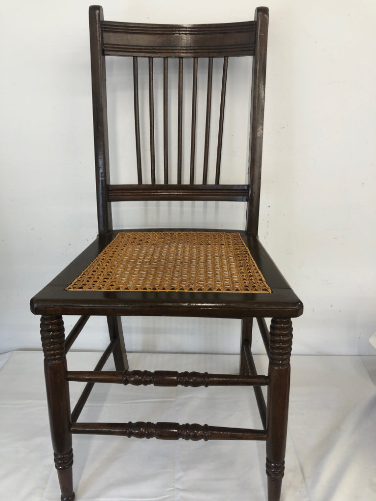 VTG DARK WOOD ACCENT CHAIR W TAN SEAT.