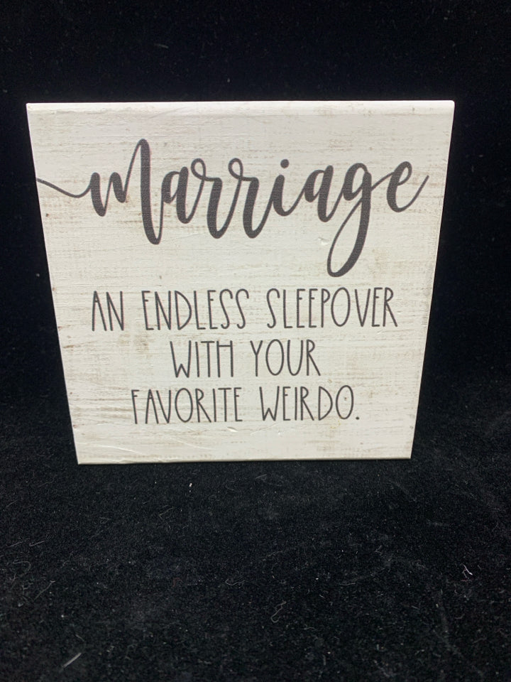 MARRIAGE AN ENDLESS WHITE BLOCK SIGN.