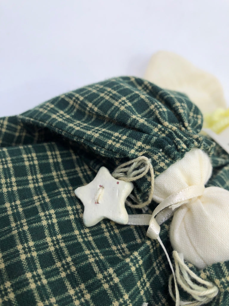 SOFT WHITE ANGEL IN GREEN FLANNEL DRESS.