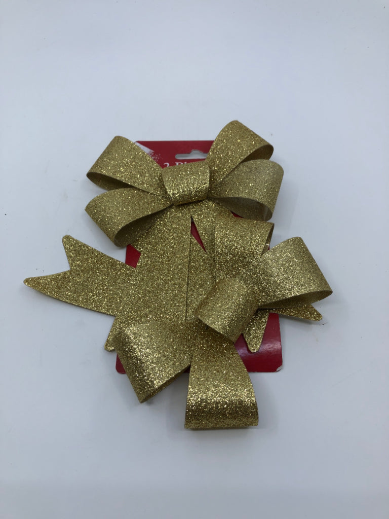 NIP GOLD BOWS.