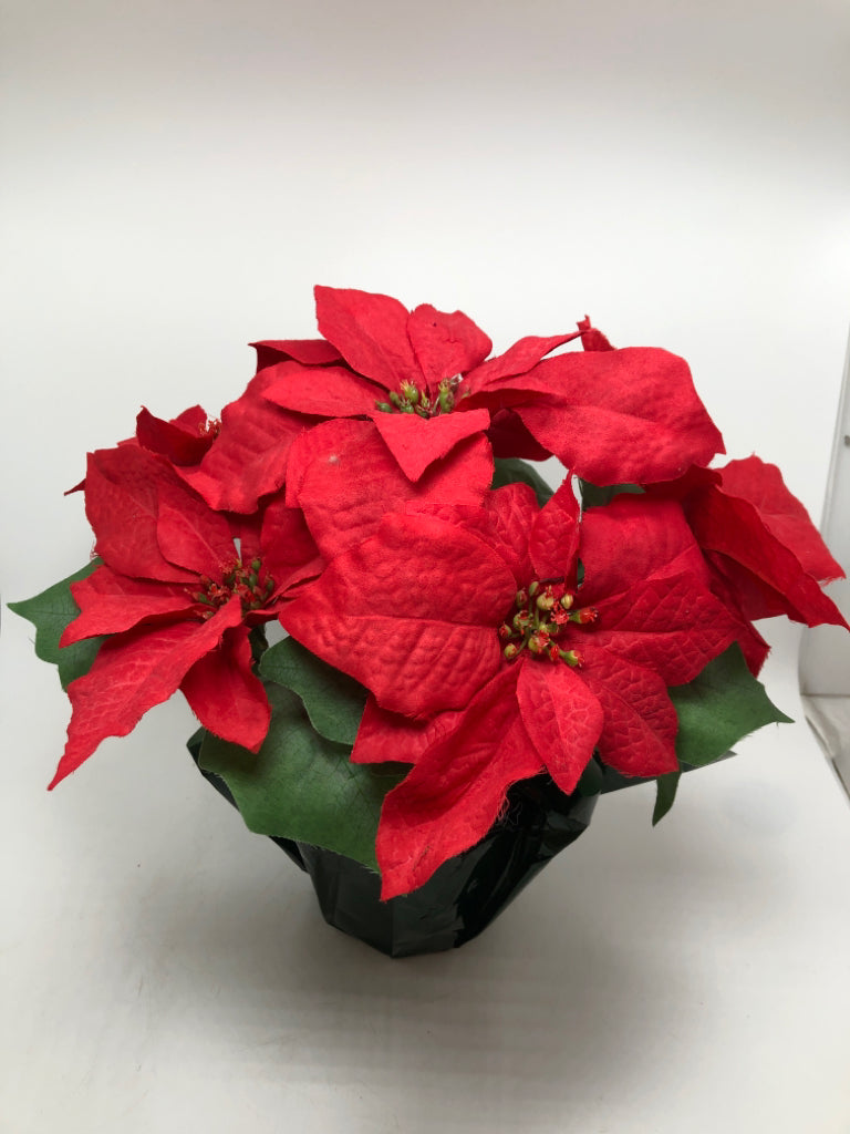 FAUX POINSETTIA IN GREEN WRAP POT.