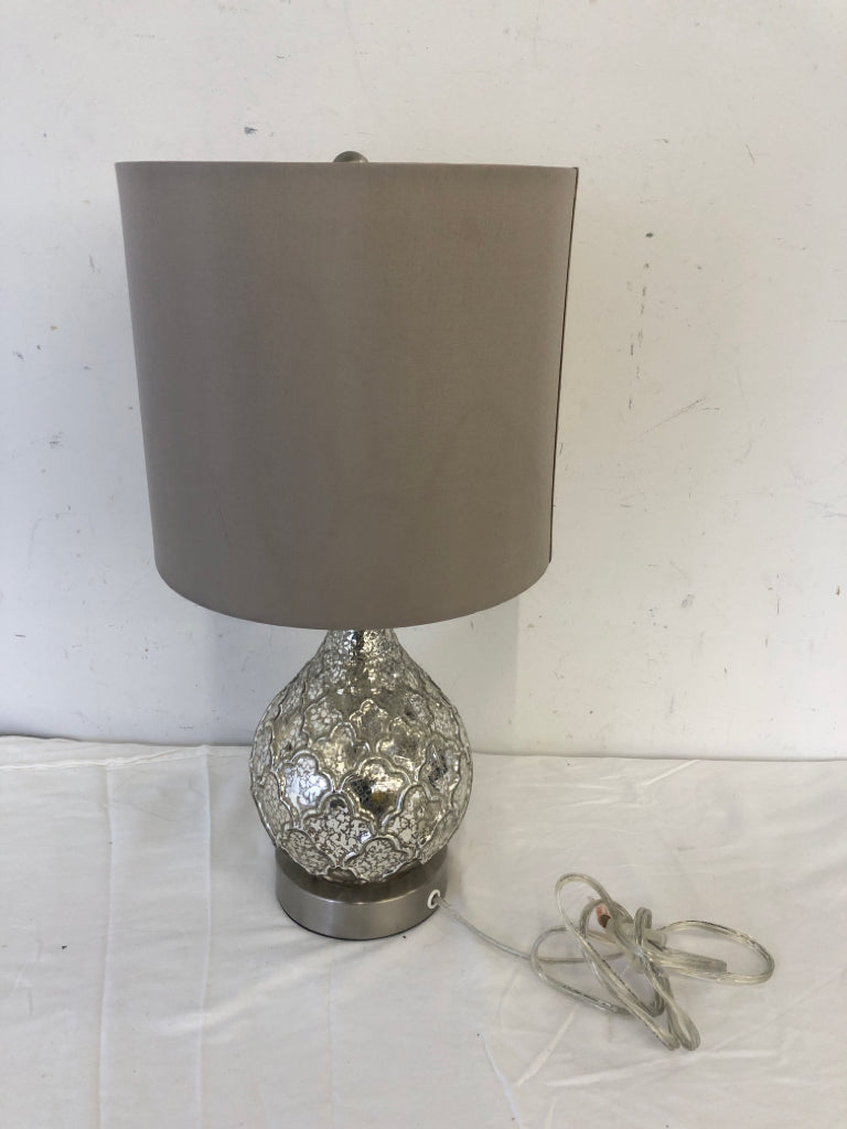 SILVER MERCURY BASE LAMP W TAN SHADE.