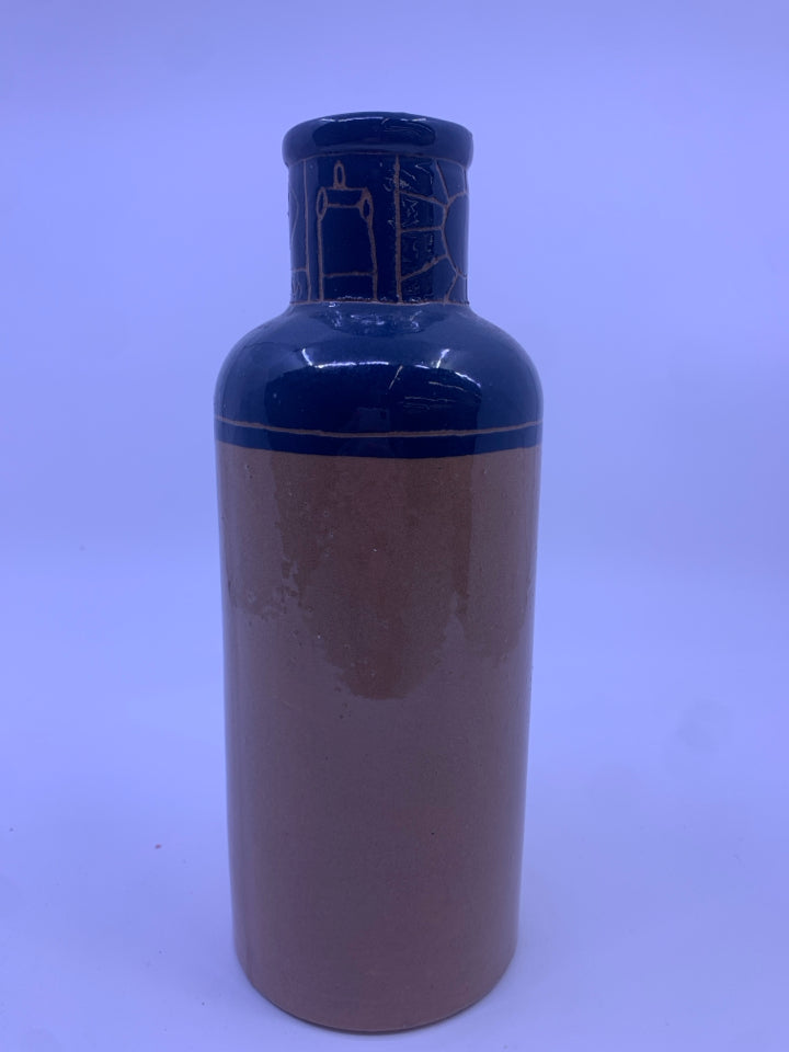 BROWN BASE VASE W/ DARK BLUE NECK W/ CARVINGS.