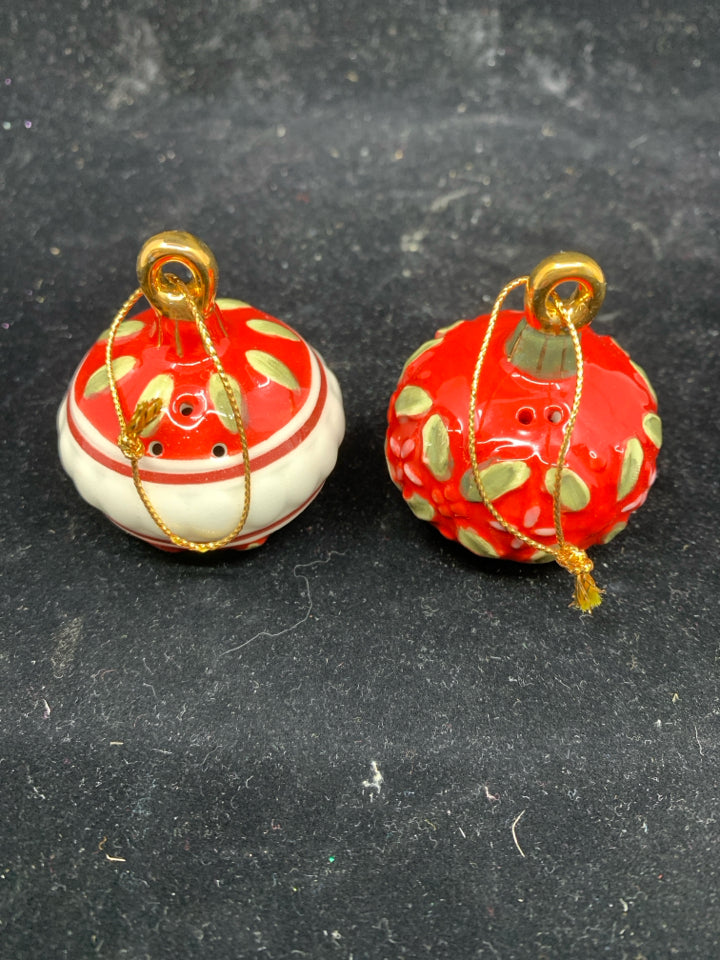 RED ORNAMENT SALT AND PEPPER SHAKERS.