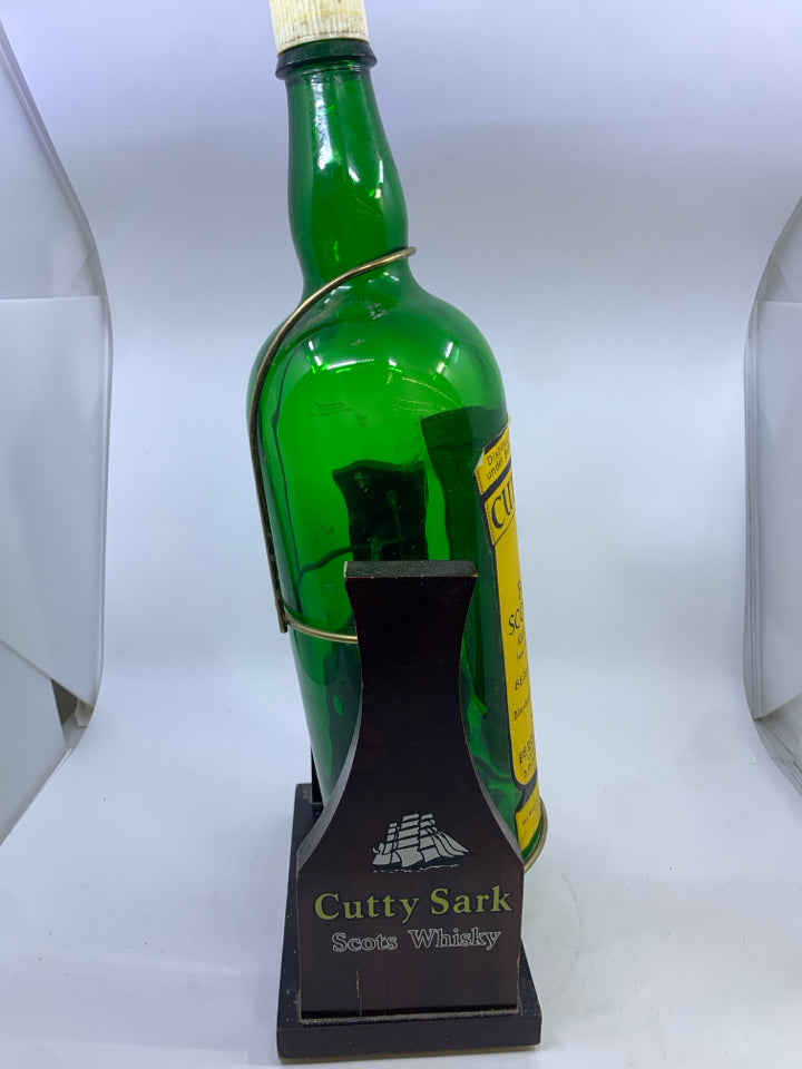 VTG CUTTY SARK WHISKY DISPLAY BOTTLE W/WOODEN SWING CRADLE STAND.