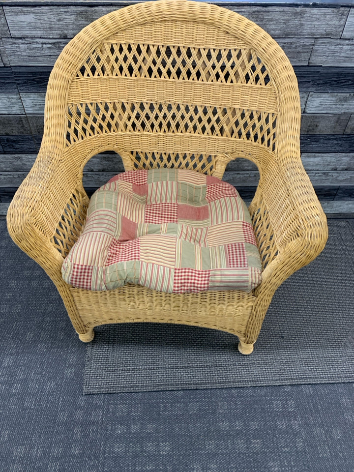 BLONDE WICKER CHAIR W/ PLAID CUSHION.