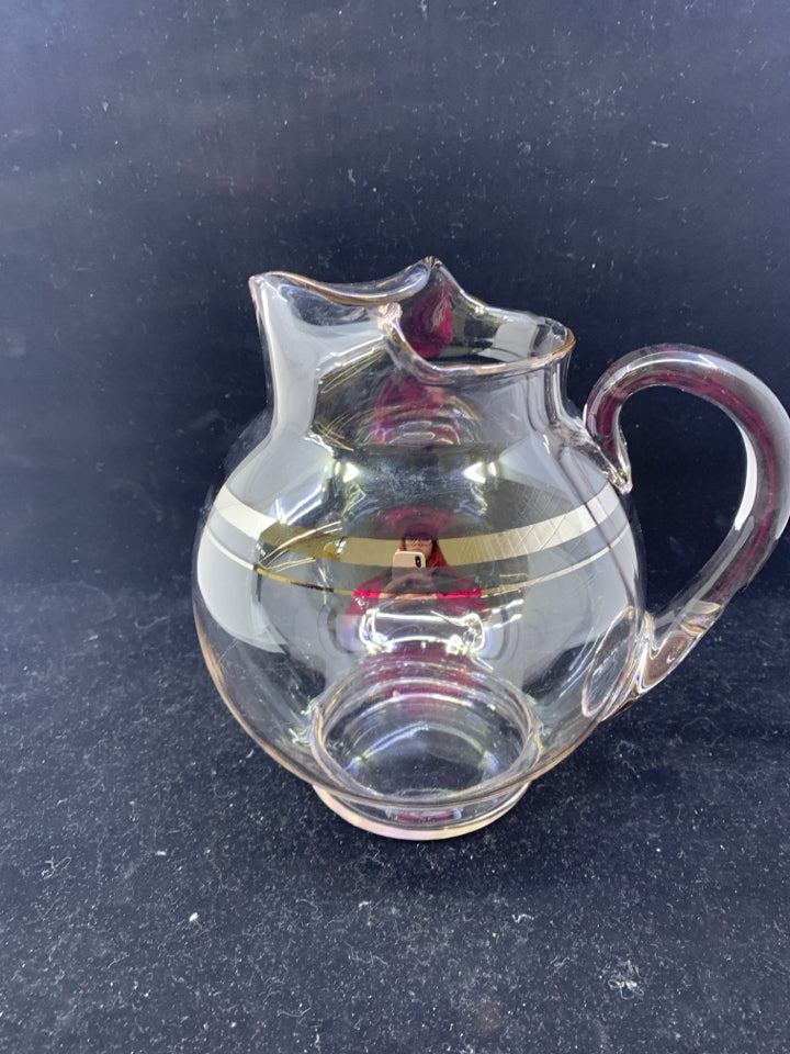 ROUND BULB PITCHER W SILVER RIM.