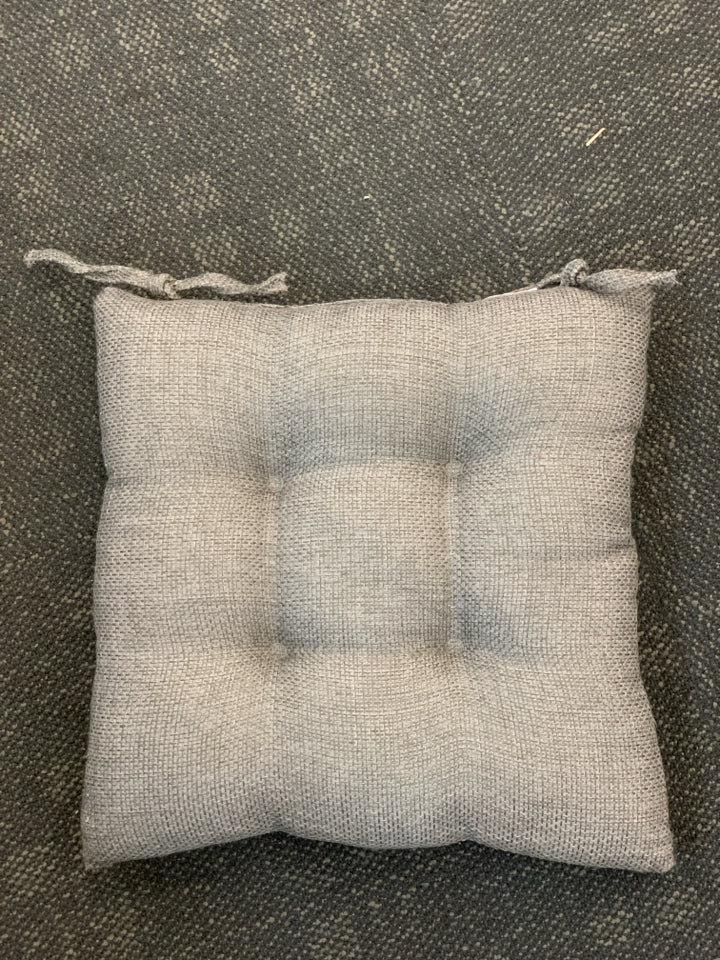 2 GREY TEXTURED CHAIR CUSHIONS.