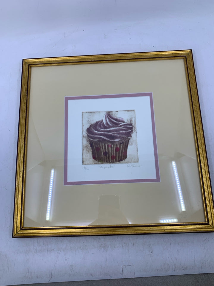 CUPCAKE ETCHING SIGNED BY ARTIST IN GOLD FRAME.