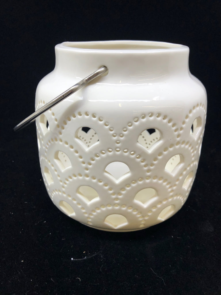 WHITE W/CUTOUTS CERAMIC CANDLE LANTERN.