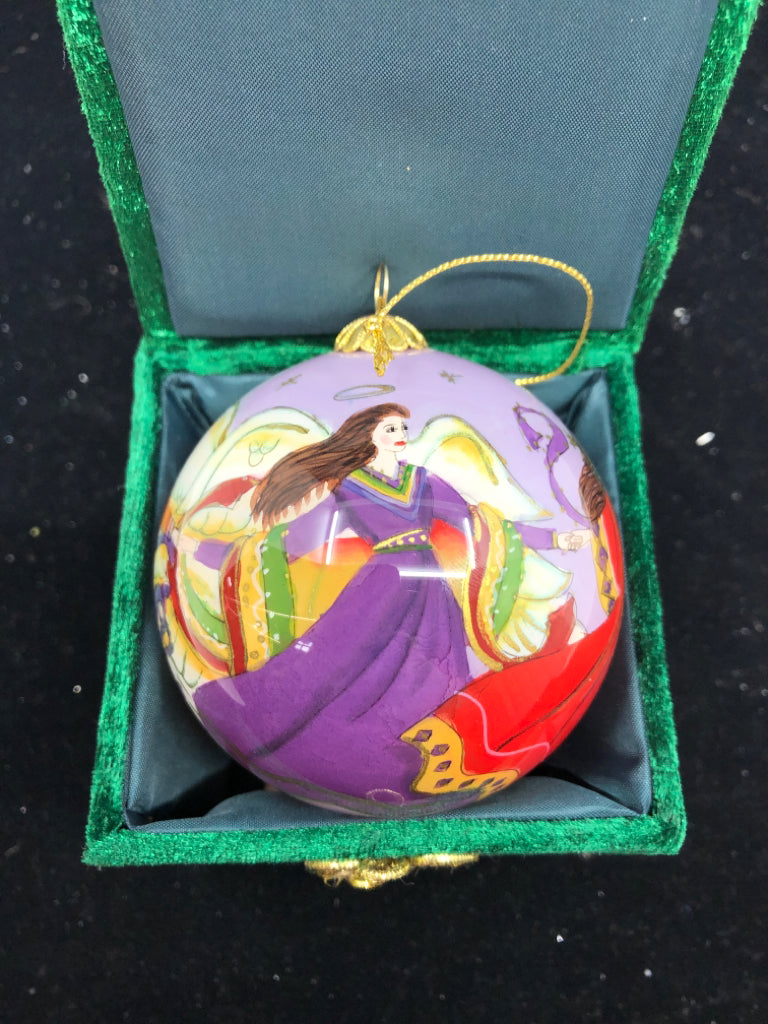 PURPLE ANGLE SPHERE ORNAMENT IN GREEN BOX.