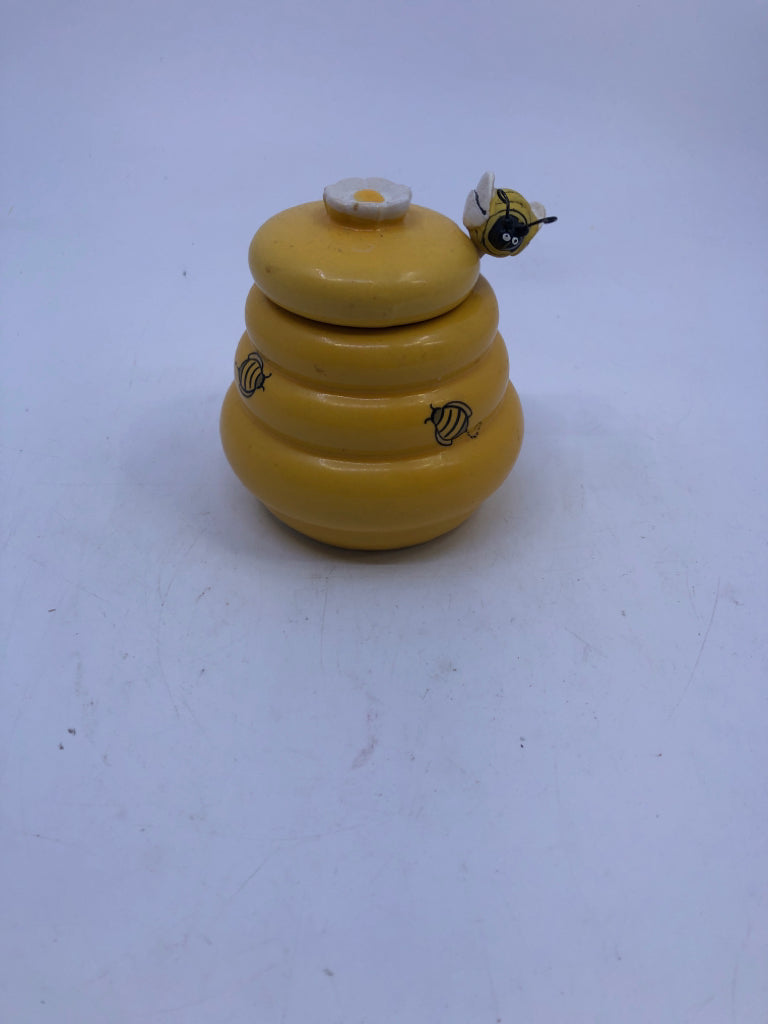YELLOW HONEY JAR WITH SPOON AND LID.
