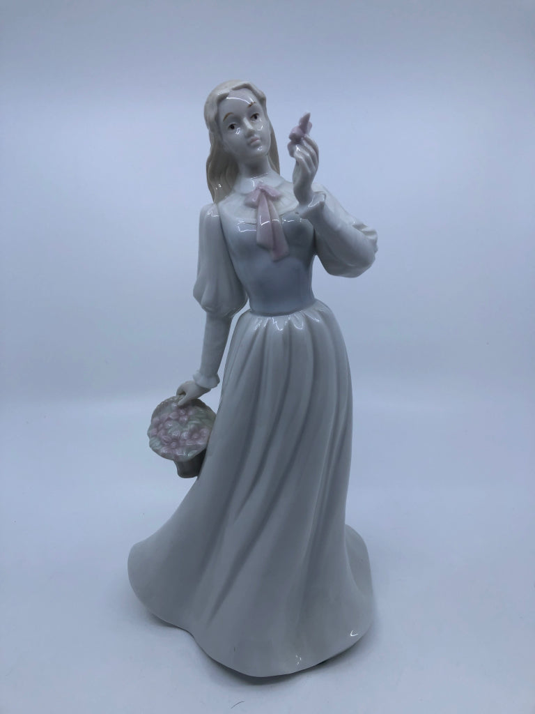 LADY W/BASKET OF FLOWERS PORCELAIN FIGURINE.