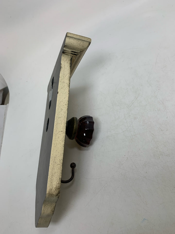 RUSTING DOOR KNOB HOOK WALL HANGING.