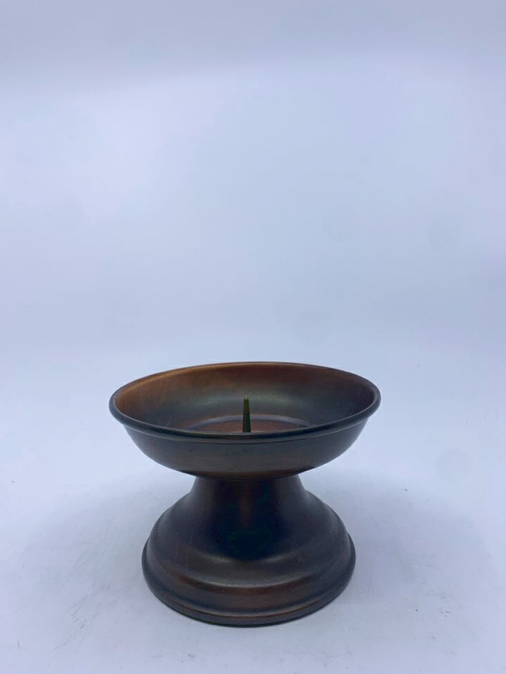 BRONZED METAL PILLAR CANDLE HOLDER.