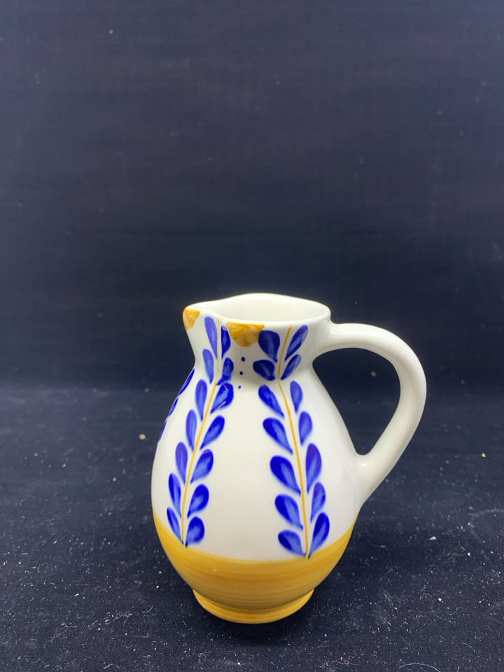 YELLOW AND BLUE FLORAL CREAMER.