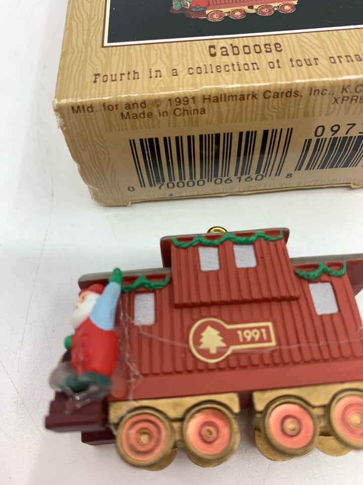 HALLMARK CABOOSE ORNAMNET IN BOX.