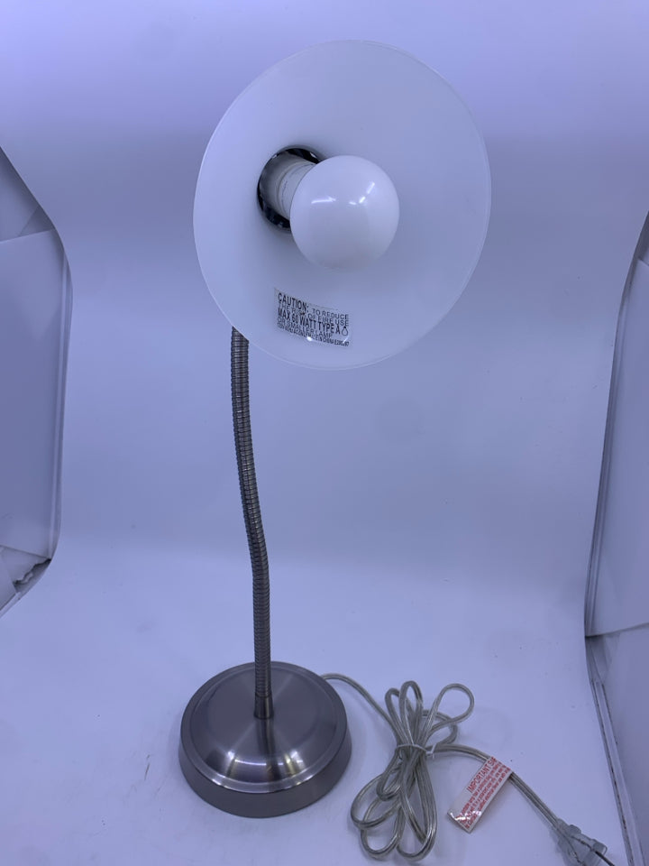 SILVER ADJUSTABLE LAMP W CLEAR PLASTIC SHADE.