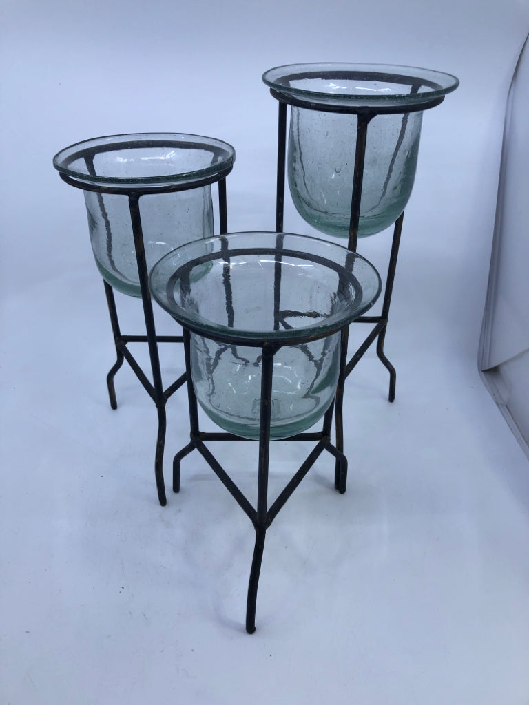 3 DISTRESSED FOOTED CANDLE HOLDERS W/ GLASS INSERTS.