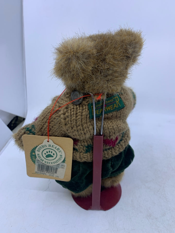LIGHT BROWN BEAR W/ TAN HEART SWEATER GREEN PANTS ON STAND.
