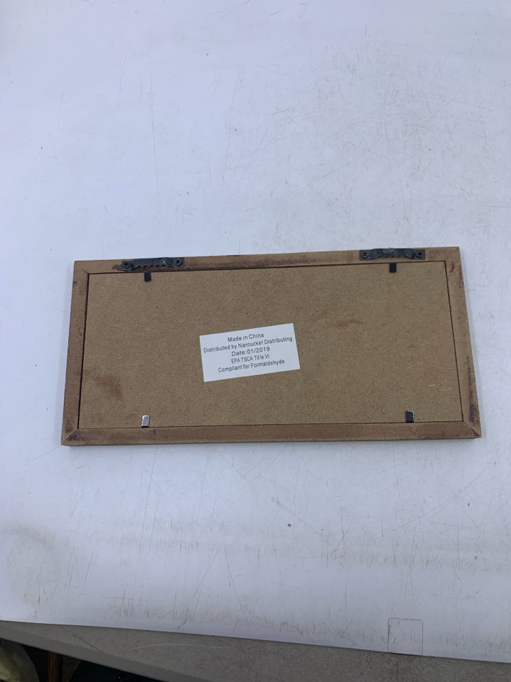 A SPOILED ROTTEN WALL HANGING.