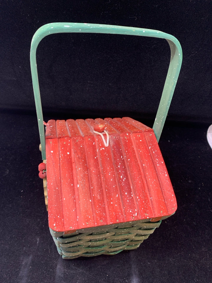 GREEN HOLIDAY BASKET W/ RED LID HOLLY DESIGN WHITE SPECKLES.