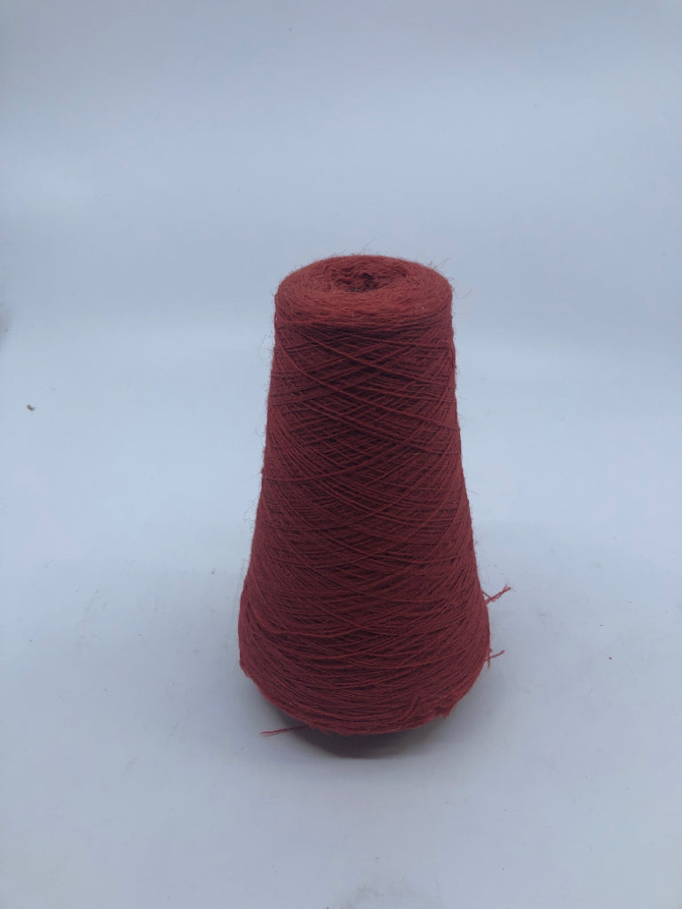 RED THREAD ON A SPOOL.