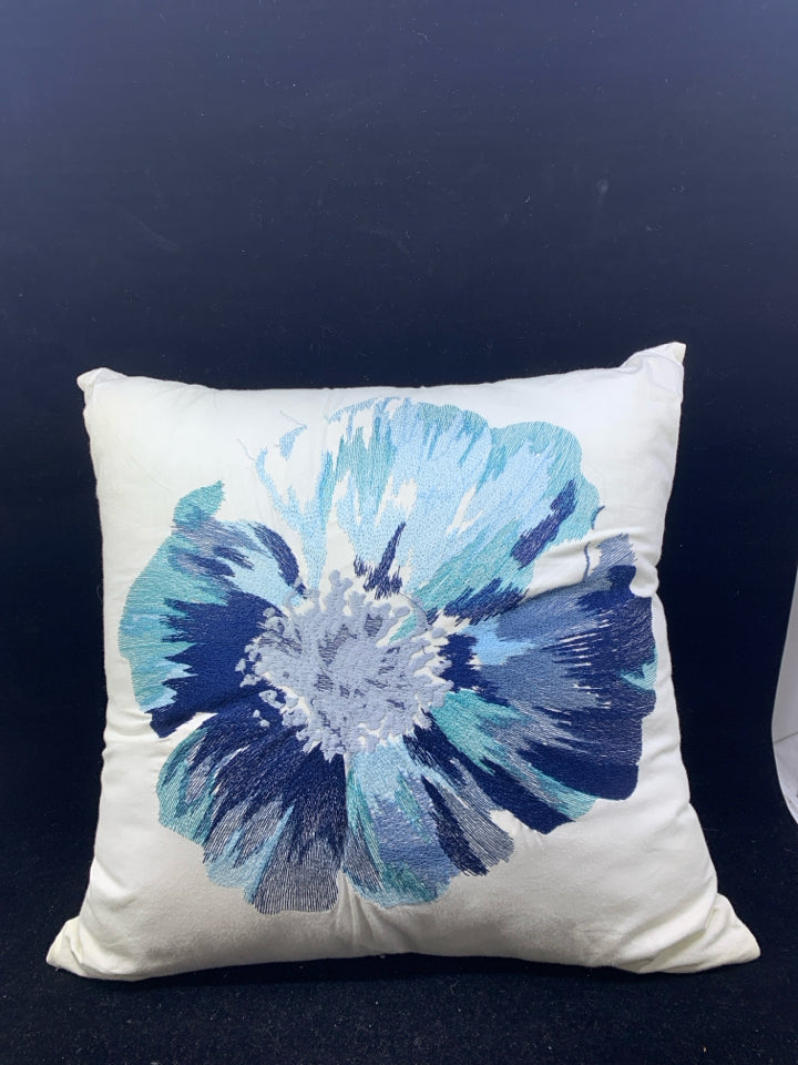 SQUARE WHITE PILLOW W/BLUE FLOWER.