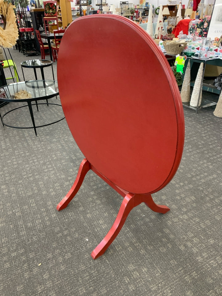 OVAL RED FLIP TOP TABLE.