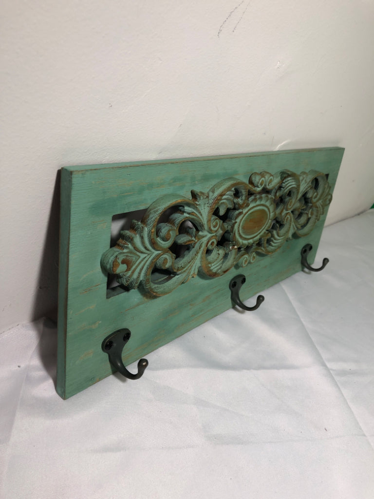 GREEN WASHED 3 HOOK WALL HANGING.
