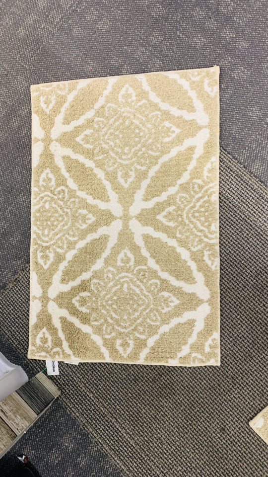 SONOMA TAN AND WHITE AREA RUG.