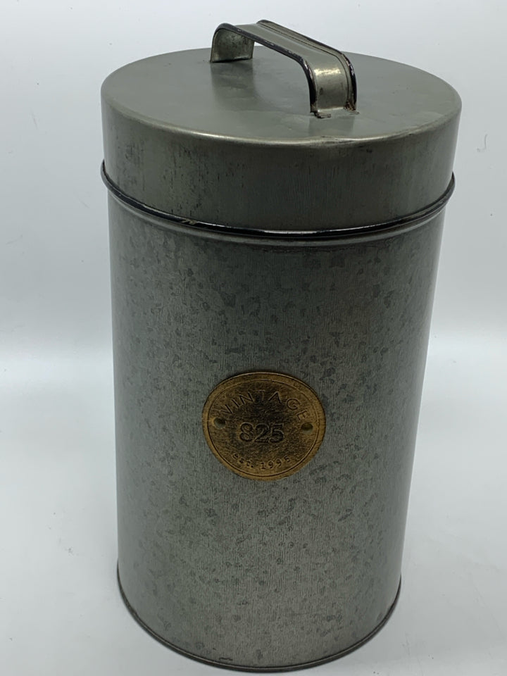 GREY METAL CANISTER W/VINTAGE LABEL AND LID.