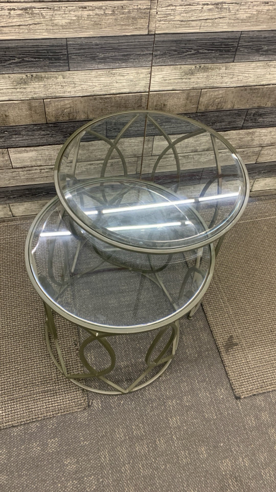 2PC ROUND GLASS STACKING TABLES W/METAL LEGS.