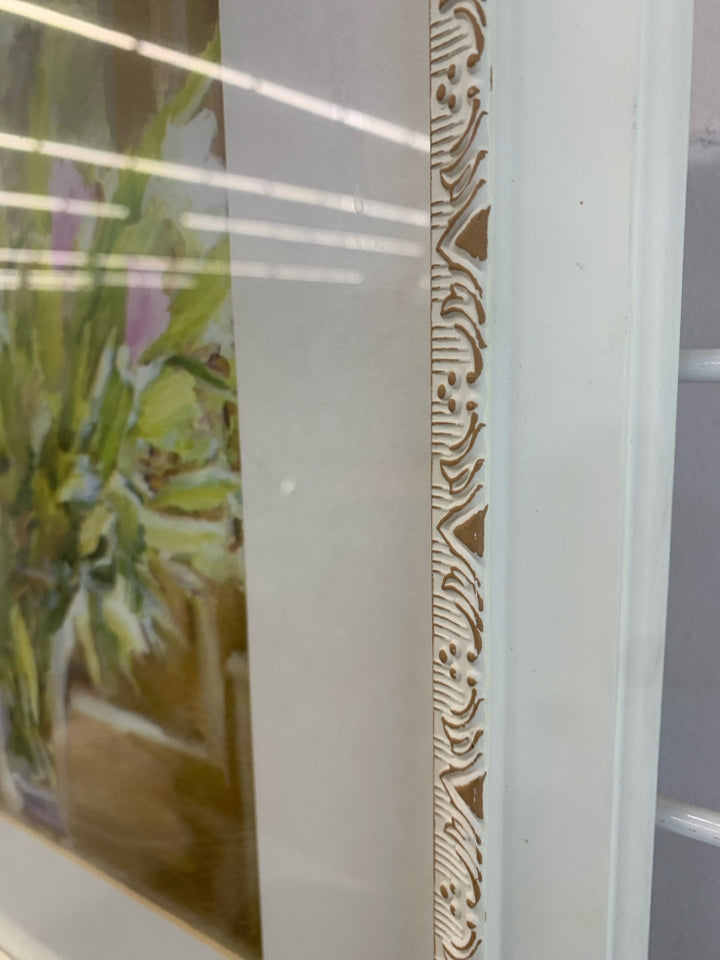 PAINTED FLOWERS BY WINDOW IN WHITE FRAME.