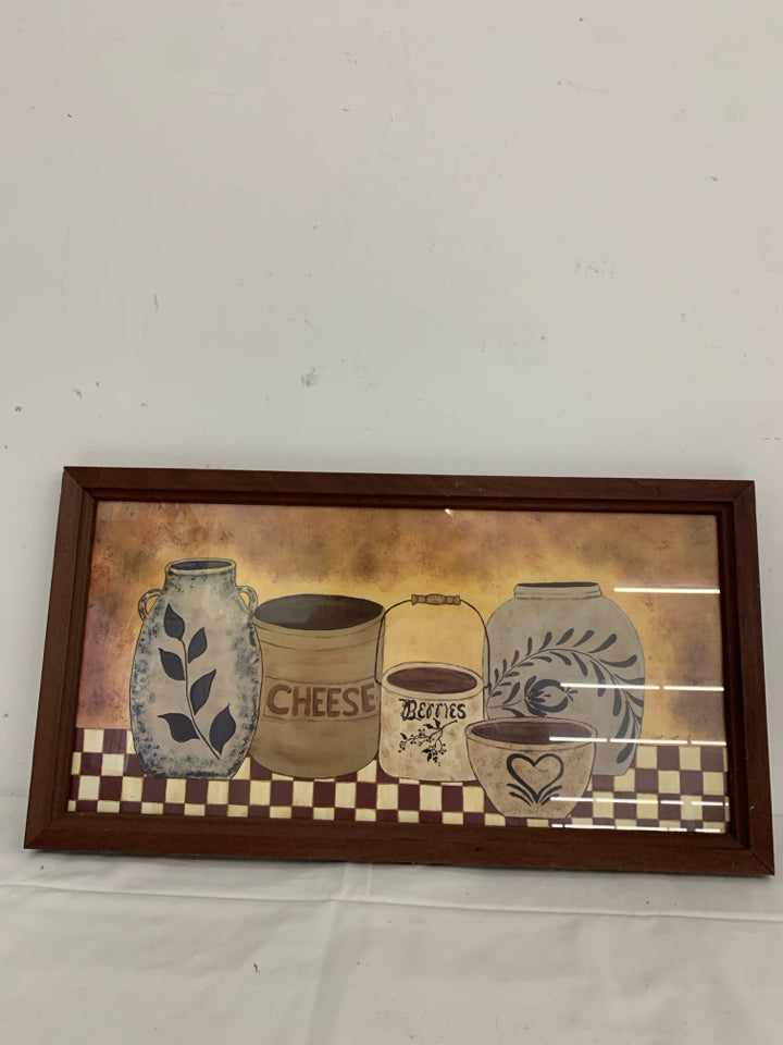 PRIMITIVE JAR WALL HANGING IN MAROON FRAME.