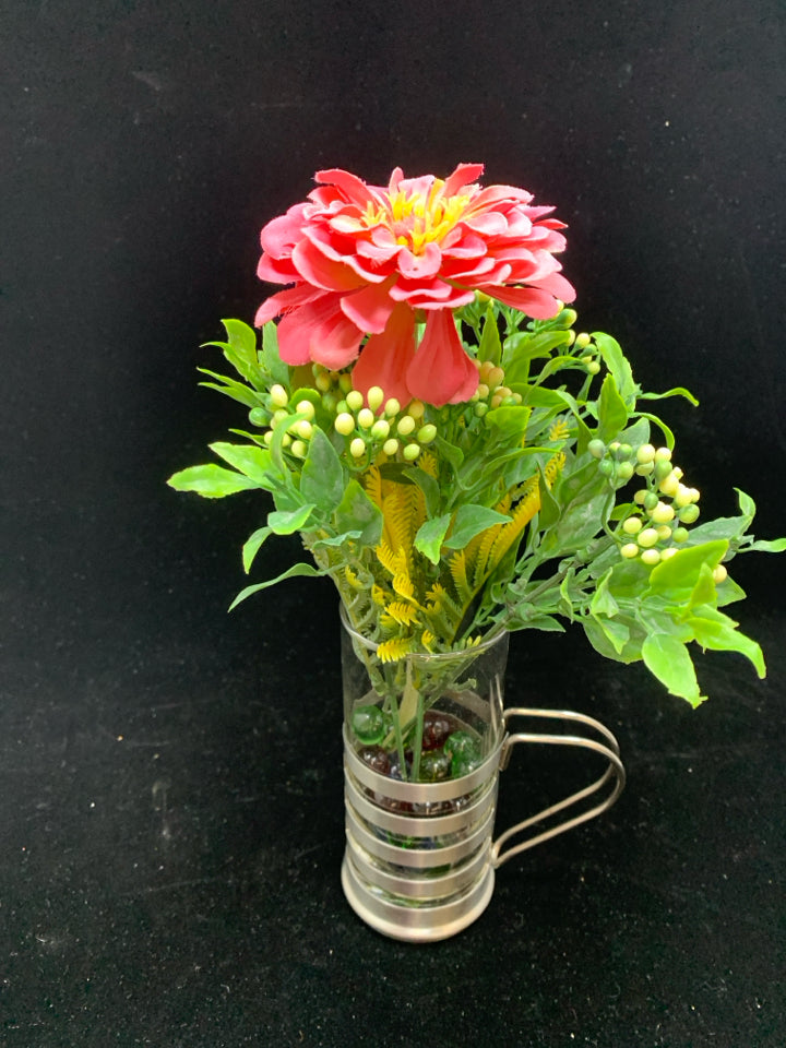 FAUX CARNATION IN GLASS AND SILVER MUG W/MARBLES.