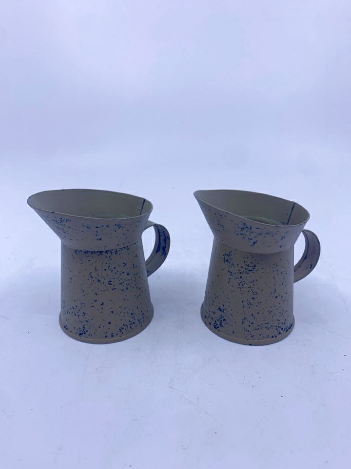 2 TAN METAL PITCHERS.