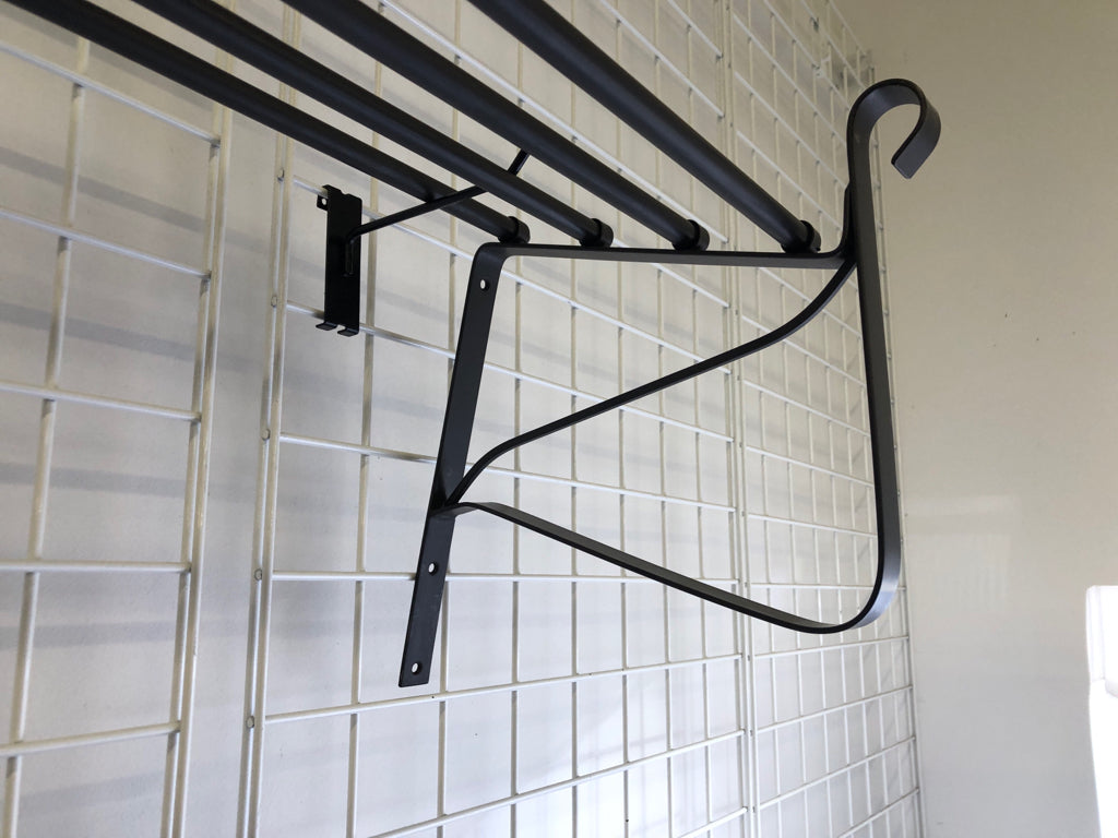 LARGE GREY SCROLL METAL WALL SHELF.