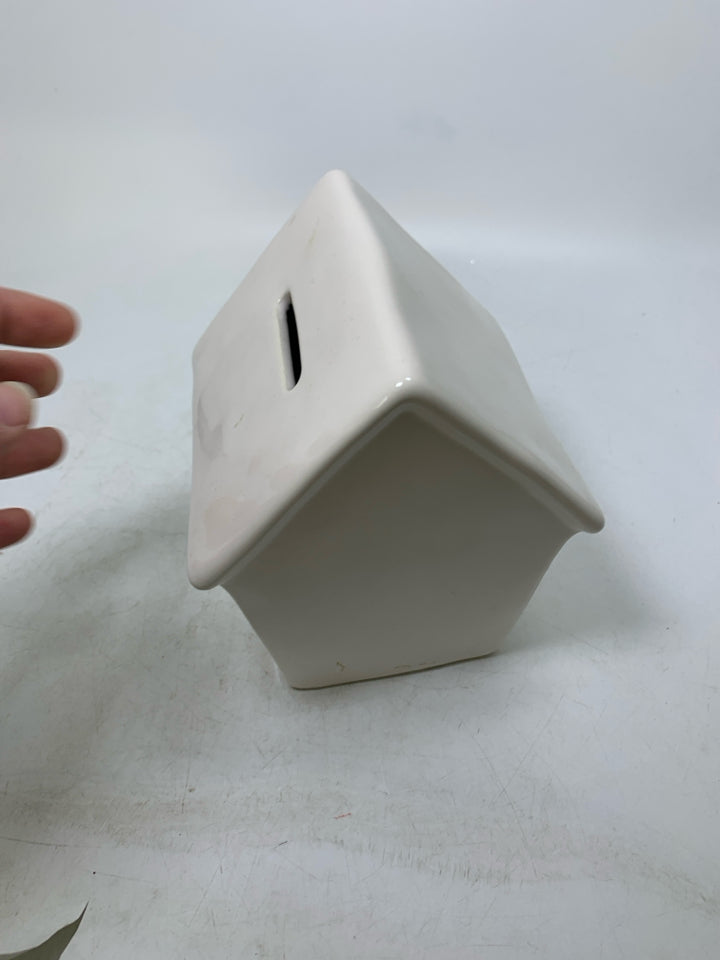 "WINE STASH" CERAMIC BIRDHOUSE COIN BANK.