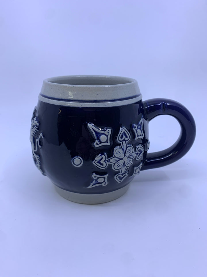 COREZELIUS COBALT BLUE MUG W/ GRAY DESIGNS.