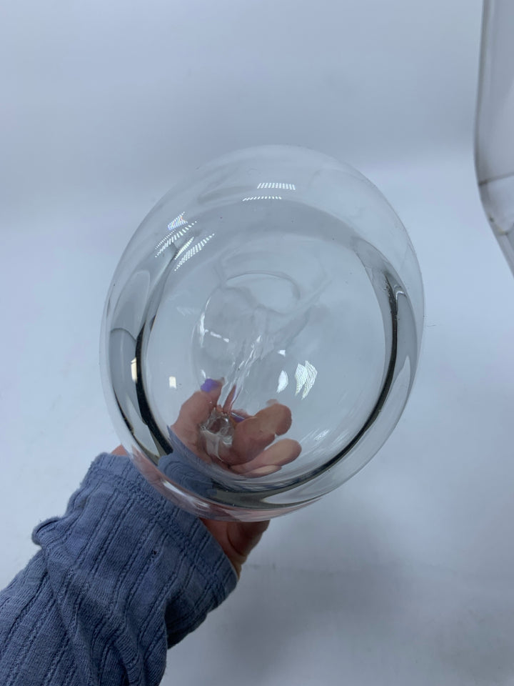 CLEAR GLASS PITCHER W/ CIRCLE HANDLE THROUGH CENTER.