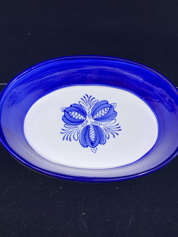 LARGE BLUE AND WHITE OVAL DISH IN BLACK STAND.