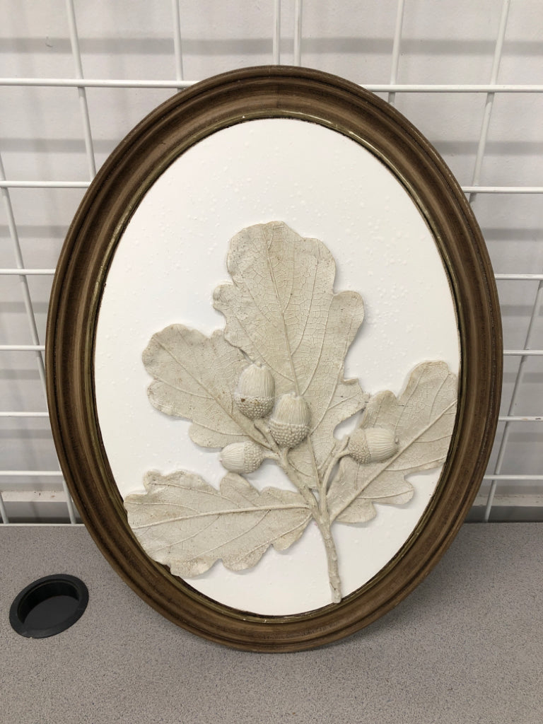 OVAL WOOD FRAMED ACORN PLASTER DECOR.