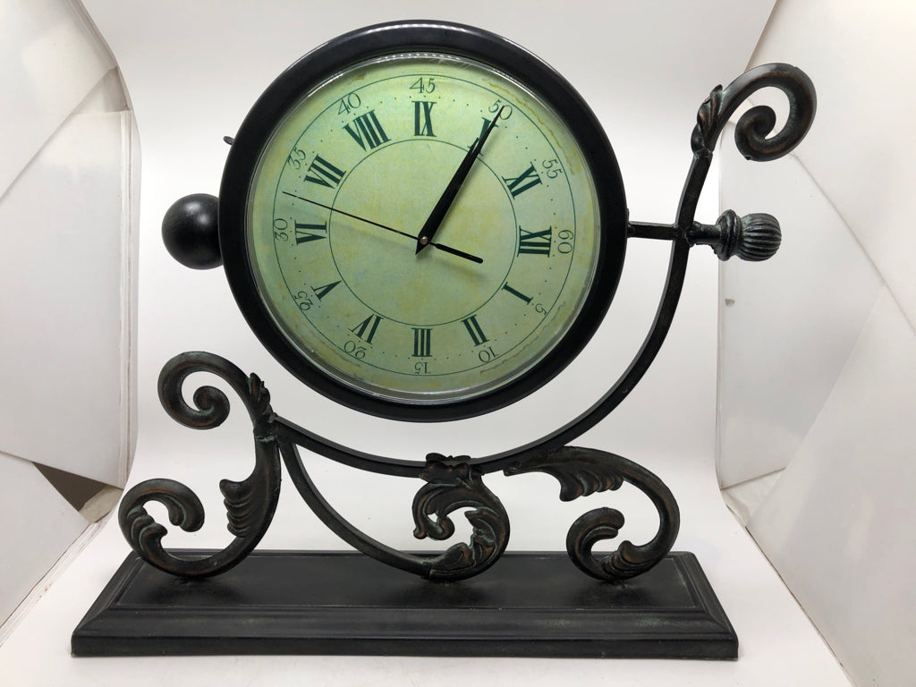 BRUSHED METAL SCROLL SHELF CLOCK.