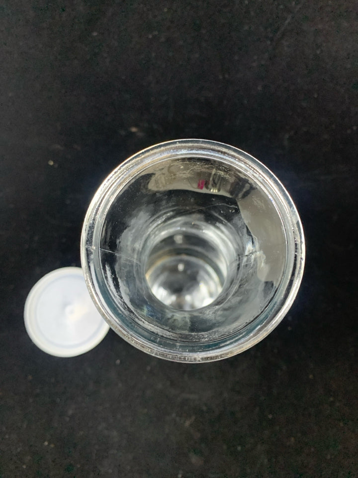 CARAFE W/EMBOSSED FLOWER AND PLASTIC LID.