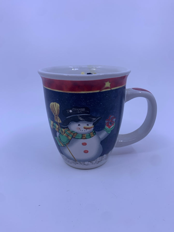 CANDLE IN SNOWMAN MUG.