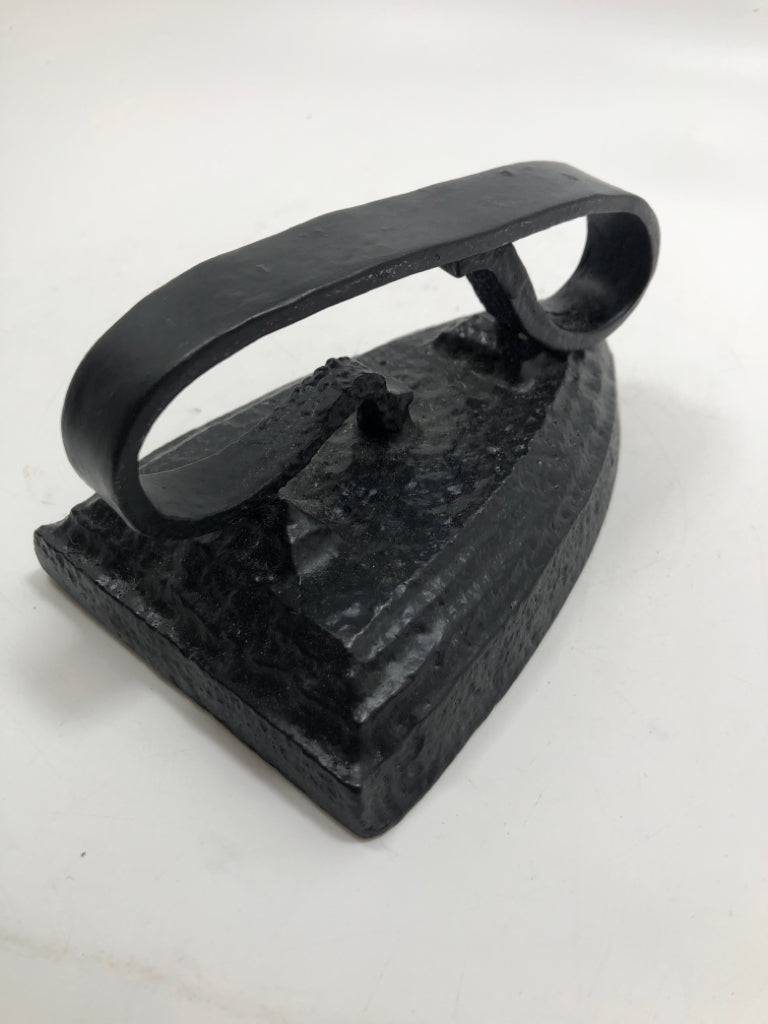 BLACK SAD IRON DOOR STOP.