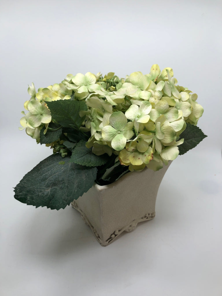 GREEN FLORALS IN WHITE PLANTER W/CRAZING.